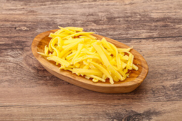 Shredded yellow cheese in the bowl