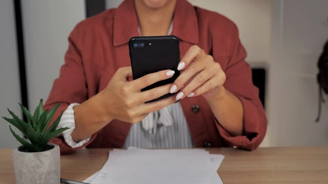 Closeup view female hands holding smartphone scroll news feed 4k