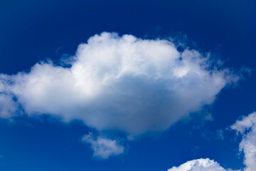 Skyscape. White delicate cloud on blue sky