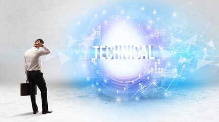 Rear view of a businessman standing in front of TECHNICAL inscription, modern technology concept