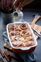 Fresh baked homemade cinnamon rolls with icing, real autumn vibes