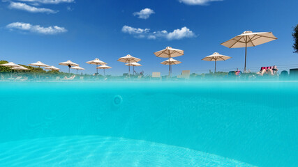 Underwater split photo of paradise turquoise pool as seen in exotic resort