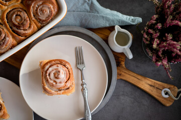 Fresh baked homemade cinnamon rolls with icing, real autumn vibes