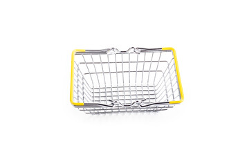 studio lighting. toy metal basket for products. On white background. Close-up.