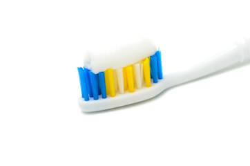 Toothbrush with colored bristles on a white background