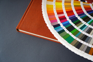Assortment of ral color samples lying on the book