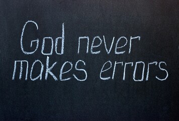 
Chalkboard text God never makes errors. Motivational and religious lettering