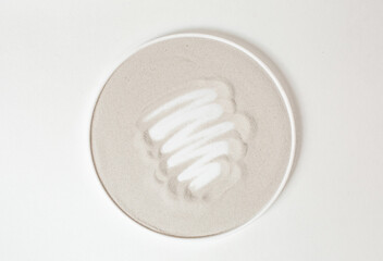Fototapeta na wymiar circle beige strokes white cream center background
