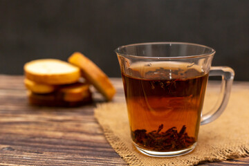 Cup of tea on wooden table. Hot cup of tea.