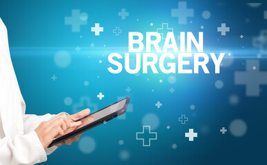 doctor writes notes on the clipboard with BRAIN SURGERY inscription, first aid concept