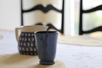 cup and pot on table