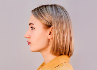 Portrait of beautiful young european woman profile view