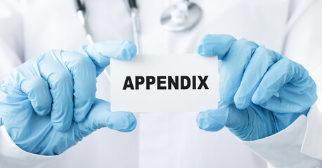 doctor hands holding a card with APPENDIX text. Healthcare concept.