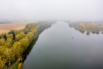 Drone photo of Lake Gebart on a foggy autumn morning in City Zalaegerszeg, Hungary