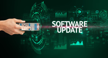 hand holding wireless peripheral with SOFTWARE UPDATE inscription, modern technology concept