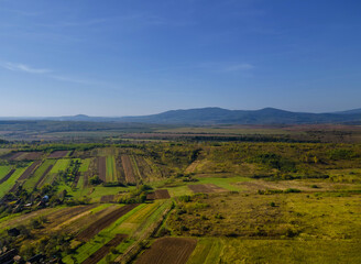 Naklejka premium Aerial view of green farmland cultivated field from of the countryside