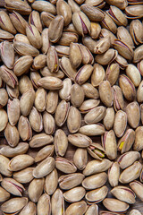 Background of pistachio nuts. Flat layout. Nuts close up