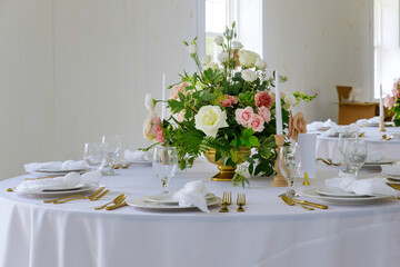 Beautiful table set for wedding . Flowers arrangement.