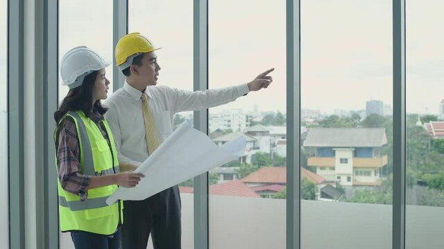 Business concept. An engineer talking to work inside the building. 4k Resolution.