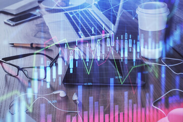 Double exposure of forex chart drawing and cell phone background. Concept of financial trading