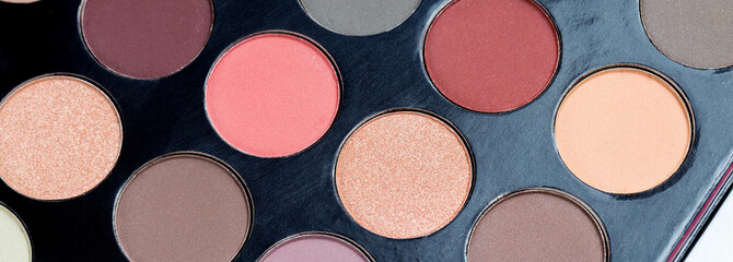 Colorful eye shadows palette. Colorful make-up palette background.