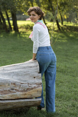 Young woman in the park. Cute girl portrait in french style.