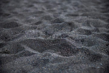 Iceland abstract view of Reynisfjara black sand beach in Vik volcanic lava texture closeup and...