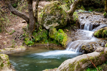Fototapeta na wymiar Waterfalls and mountain river in autumn