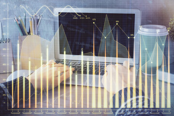 Double exposure of woman hands typing on computer and forex chart hologram drawing. Stock market...