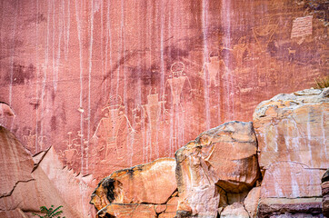 Cliff wall petroglyphs symbols of ancient Anasazi Indian tribe people in Capitol Reef National Park...