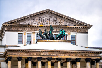 Warszawa Grand National Opera or Teatr Narodowy in Warsaw, Poland downtown with statue sculpture of Apollo on horse drawn chariot with relief pediment architecture - obrazy, fototapety, plakaty