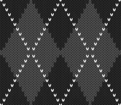 Knitted argyle Halloween pattern. Wool knitinng. Scottish plaid in gray and black rhombuses. Traditional  Scottish background of diamonds . Seamless fabric texture. Vector illustration