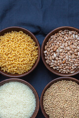 assortment grains beans lentils rise pasta rustic background