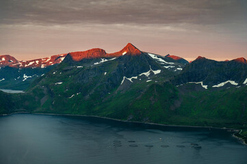 Sunset over Senja island in Northern Norway , mount Hesten in the middle of frame. (high ISO image)