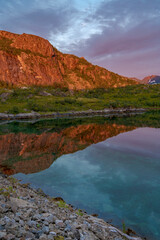 Fototapeta na wymiar Lofoten archipelago, reflection in water during colourful sunset in Northern Norway, Lofoten.