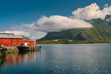 Lofoten Summer Landscape Lofoten is an archipelago in the county of Nordland, Norway. Is known for a distinctive scenery with dramatic mountains and peaks.