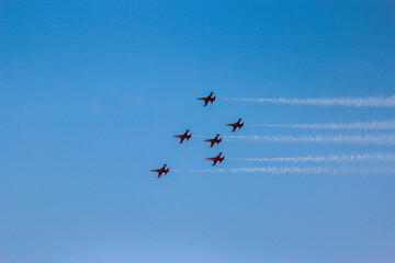Naklejka na ściany i meble Airplanes flying in formation against blue sky 