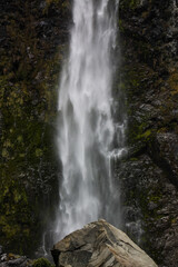 Fototapeta na wymiar waterfall and a rock