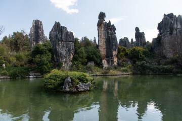 Fototapeta na wymiar February 2019, Kuniming, Yunnan Stone Forest Geological Park, Shilin County. The Kunming Stone Forest, Shilin in Chinese, is a spectacular set of limestone groups and the representative of the karst
