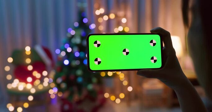 woman watch green screen smartphone