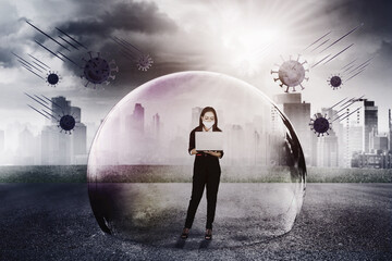 Female manager use laptop inside bubble protection