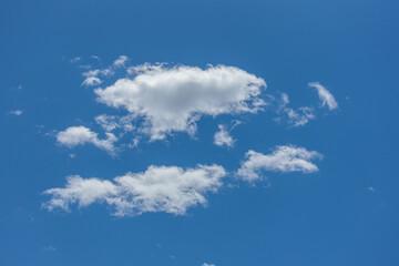 large puffy cumulus clouds bright blue sky
