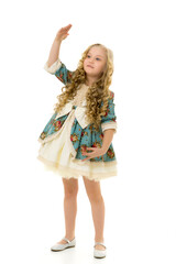 A little girl in a doll costume repeats her movements.