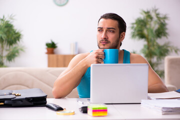 Young man working from house during pandemic