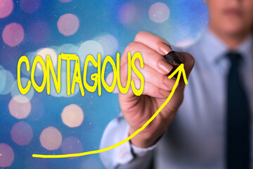 Text sign showing Contagious. Business photo text transmissible by direct or indirect contact with infected an individual digital arrowhead curve rising upward denoting growth development concept