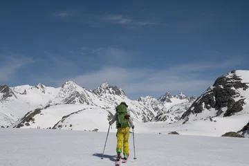 Fotobehang Skier approaching mountains winter © Mountain Goat Photo