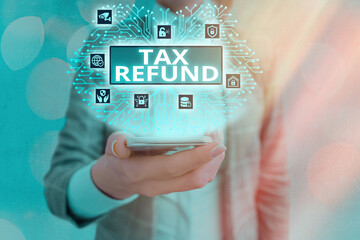 Conceptual hand writing showing Tax Refund. Concept meaning refund on tax when the tax liability is...