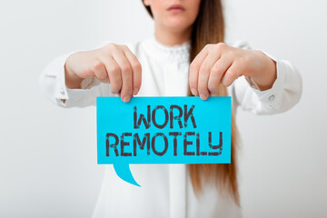 Conceptual hand writing showing Work Remotely. Concept meaning fresh working style where employees...
