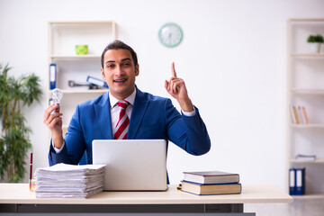 Young male employee working in the office