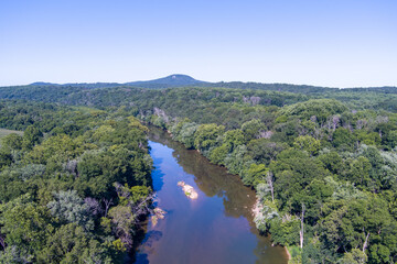 Fototapeta na wymiar Aerial view of the Monocacy River near Dickerson, Maryland. Sugarloaf Mountain is in the center.